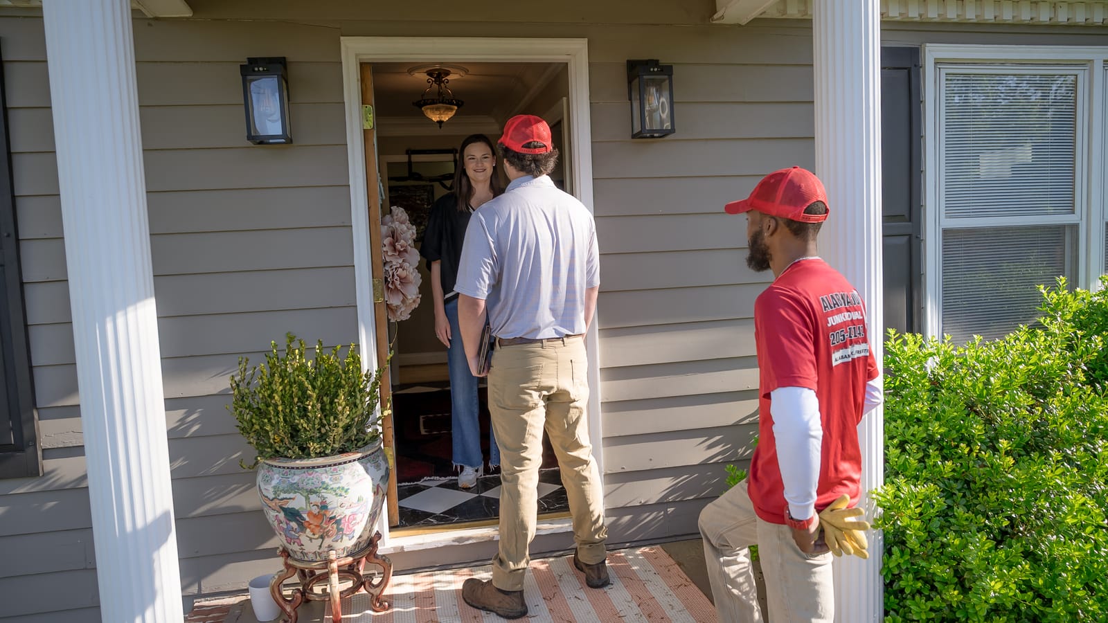 Alabama Junk Removal crew member talking with a customer in Birmingham