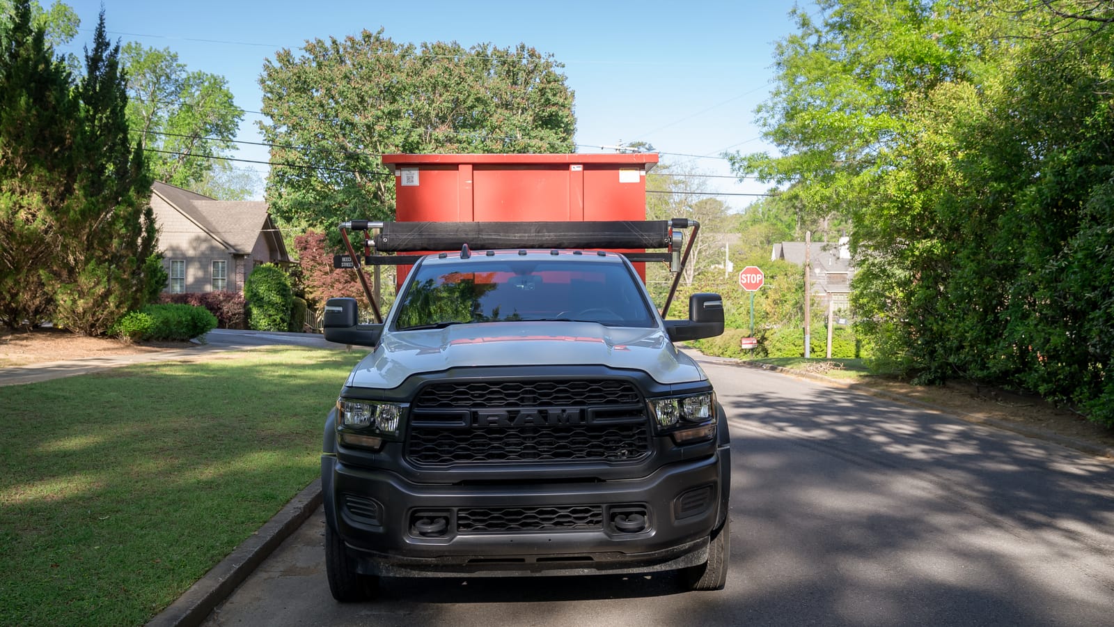 Alabama Junk Removal crew with a customer outside a Birmingham home